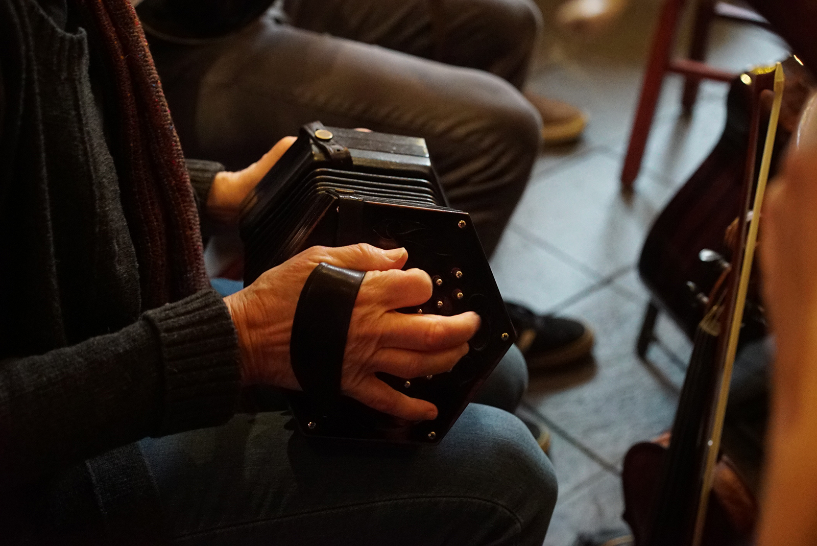 An accordion player providing live trad music for an event at The Plough and The Stars