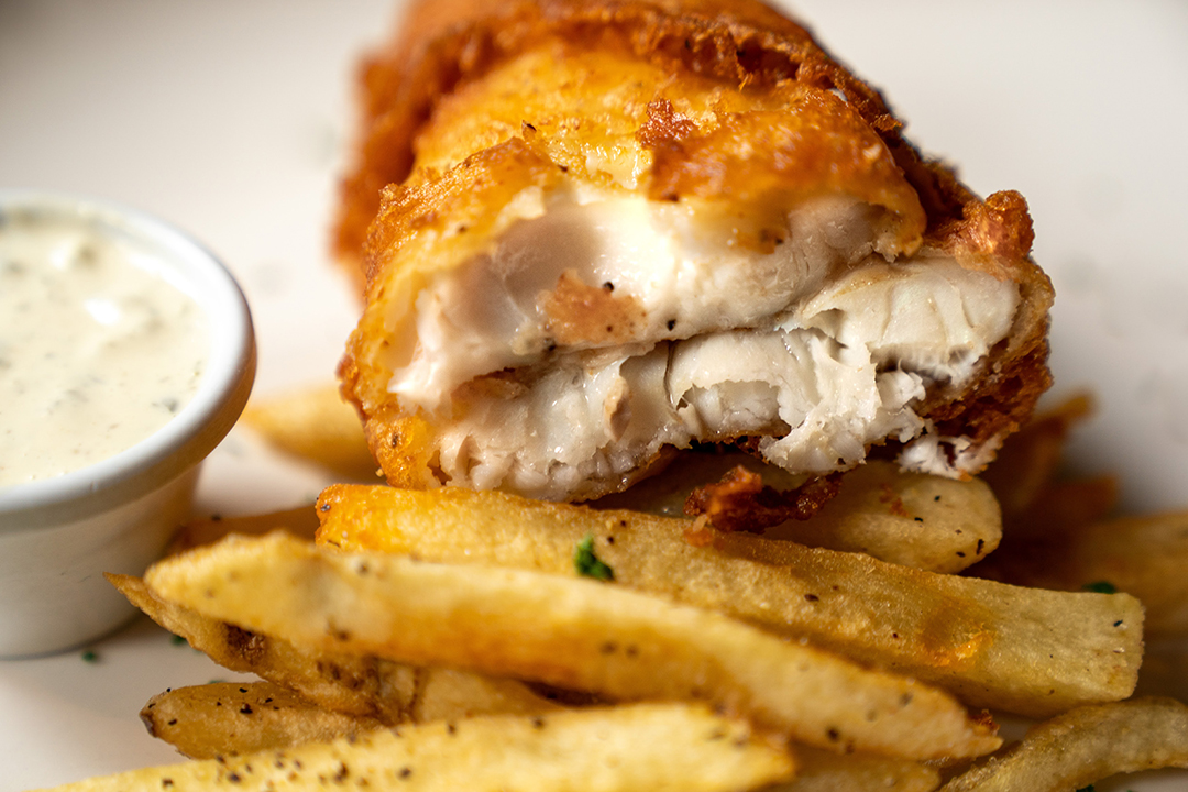 Golden beer-battered fish and chips with mushy peas at The Plough and The Stars